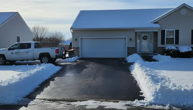 Clean residential driveway after expert snow removal by Chop Chop Landscaping in Lancaster, PA