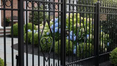 Ornamental black metal fence installation by professional landscapers in Lancaster, PA